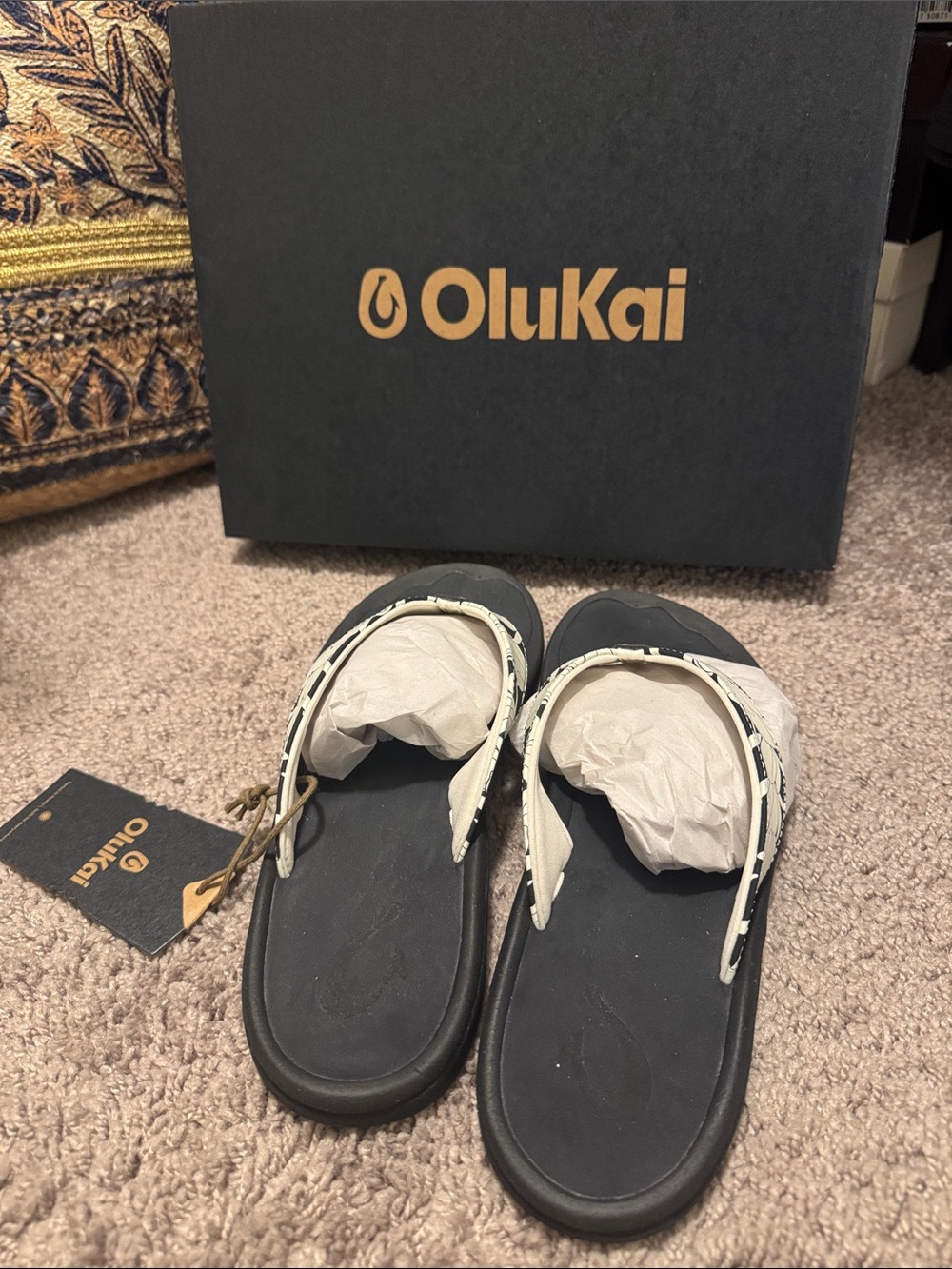 OluKai Kids Black Flip Flops with White Patterned Straps